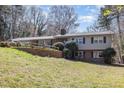 Spacious backyard with retaining wall, showcasing the home's exterior and landscaping at 105 Elizabeth St, Chapel Hill, NC 27514