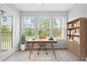 Bright home office filled with light and featuring a modern desk and bookcase at 1300 Hillbrow Ln # 204, Raleigh, NC 27615