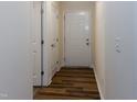 Inviting hallway with neutral walls and modern wood-look flooring at 151 Goose Creek Cir, Dunn, NC 28334
