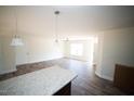 Bright kitchen with granite countertops, stainless steel appliances, and a central island at 20 Golden Poppy Ln, Youngsville, NC 27596