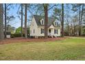Beautiful two-story home with dormer windows and lush green lawn at 204 Arnold Ln, Fuquay Varina, NC 27526