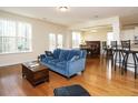 Bright open-concept living area with hardwood floors and an abundance of natural light at 2217 Magnolia Tree Ln, Durham, NC 27703