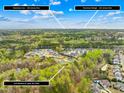 Aerial view showcasing the neighborhood, nearby amenities, and the home's location at 2223 Winston Cir, Apex, NC 27502