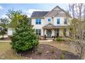 Charming two-story home boasts meticulous landscaping and inviting curb appeal at 240 Swann Trl, Clayton, NC 27527