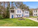 Beautifully landscaped home with a screened porch and a well-manicured lawn at 2816 Delco Ct, Raleigh, NC 27610