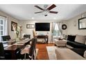Cozy living room featuring hardwood floors, a ceiling fan, and a comfortable seating area at 2816 Delco Ct, Raleigh, NC 27610