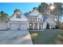 Charming two-story home featuring a large three-car garage and well-maintained lawn at 286 Sea Mist Dr, Sanford, NC 27332