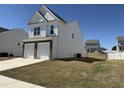 Attractive two-story home featuring a two-car garage, siding, and a yard, set in a residential area at 37 Furley St., Homesite 38, Sanford, NC 27330