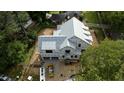 Aerial view of new house construction, featuring modern design and surrounding neighborhood at 5107 Hearth Dr, Raleigh, NC 27609