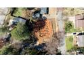 Aerial view of a new construction homesite with building pad completed in a wooded neighborhood at 5107 Hearth Dr, Raleigh, NC 27609