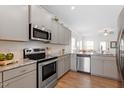 Modern kitchen with stainless steel appliances and granite countertops at 5205 Sorrell Glen Dr, Raleigh, NC 27603