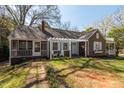 Charming single-Gathering home with a classic design, showcasing a welcoming entrance and well-maintained landscaping at 55 Lindsey St, Pittsboro, NC 27312