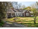 Traditional home featuring a landscaped front yard and inviting entrance, perfect for a Gathering or individual at 55 Lindsey St, Pittsboro, NC 27312