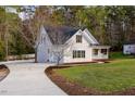 Beautiful two-story home with a spacious driveway, lush green lawn, and inviting front porch at 924 Elbridge Dr, Raleigh, NC 27603