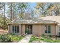 Charming one-story home featuring mature landscaping and a welcoming front entrance at 108 Beaver Dam Ct, Chapel Hill, NC 27514