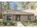 Charming one-story home featuring mature landscaping and a welcoming front entrance at 108 Beaver Dam Ct, Chapel Hill, NC 27514