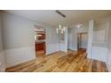 Bright dining room with stylish wainscoting and a view to the kitchen, perfect for entertaining at 1171 Jackson Ct, Creedmoor, NC 27522