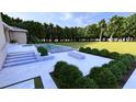 Beautiful backyard pool, patio, and lush landscaping at 1216 Barcroft Pl, Raleigh, NC 27615