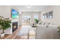 Inviting living room with fireplace, balcony access, and neutral decor at 1613 Clayfire Dr, Cary, NC 27519