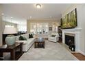 Spacious living room featuring a fireplace, neutral décor, and ample natural light at 208 Evanview Ct, Apex, NC 27523