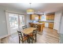 Eat-in kitchen with breakfast bar, stainless steel appliances, and a sliding glass door at 2105 Antioch Church Rd, Timberlake, NC 27583