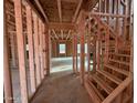 Interior framing of a new house featuring stairs and stud walls at 268 Dove Rd, Cameron, NC 28326