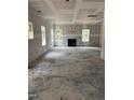 Living room featuring a fireplace and three large windows under construction at 268 Dove Rd, Cameron, NC 28326
