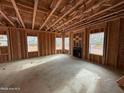 An unfinished living room featuring a fireplace and multiple windows at 268 Dove Rd, Cameron, NC 28326