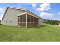 Spacious screened-in back porch overlooking the lush green lawn at 280 Providence Creek Dr, Fuquay Varina, NC 27526