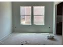 Dining area features neutral walls, and two windows overlooking backyard at 39 Atherton Circle, Angier, NC 27501