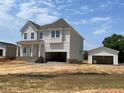 New two-story home with an attached two car garage and detached single car garage at 39 Atherton Circle, Angier, NC 27501