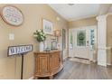 Welcoming foyer featuring hardwood floors, elegant decor, and abundant natural light streaming through the front door at 45 Pebble Creek Dr, Franklinton, NC 27525