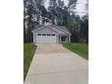 Attractive single-story home with a long drive and an attached two car garage at 5710 Russell Rd, Durham, NC 27712