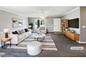 Bright living room with modern furniture, sleek decor, and natural light at 5908 O C Hester Rd, Holly Springs, NC 27540