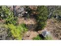 Aerial view featuring a quaint gazebo and an overview of the property's lush surroundings at 620 Sunnybrook Rd, Raleigh, NC 27610