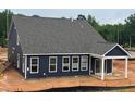 New construction shows the home's siding, roof, and white-trimmed windows at 771 Old Station Pointe, Angier, NC 27501