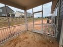 The screened porch offers an outdoor space with views of the community at 771 Old Station Pointe, Angier, NC 27501