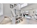 Inviting entryway with stairs, stylish console table, and an open view to the adjacent light-filled living space at 1007 Shovelhead Dr # 4, Durham, NC 27703