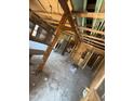 Interior view of home under renovation with exposed beams and studs at 1005 Chatham St, Sanford, NC 27330