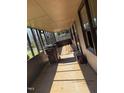 Enclosed porch with walls of windows, offering lots of light at 1005 Chatham St, Sanford, NC 27330