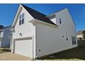 Side view of house showing two car garage at 1036 Steelhorse Dr, Fuquay Varina, NC 27526