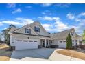 Beautiful single-story home showcasing a two-car garage and meticulous landscaping in a serene neighborhood at 1038 Branwell Dr, Durham, NC 27703