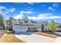Attractive single-story home boasting a two-car garage and professionally maintained landscaping on a spacious lot at 1038 Branwell Dr, Durham, NC 27703