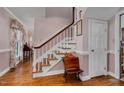 Traditional foyer with hardwood floors, staircase, and classic decor at 108 Birdie Ct, Rocky Mount, NC 27804