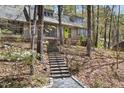 Inviting front entrance with stone steps leading to a stylish home with a vibrant green door at 1516 Cumberland Rd, Chapel Hill, NC 27514