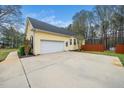 Attached two-car garage with a wide driveway offers ample parking space at 1638 Crystal Ln, Stem, NC 27581