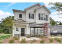 Attractive home featuring a covered entry, prominent signage and professionally landscaped yard at 176 Bruce Dr, Dunn, NC 28334