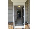 Inviting entryway featuring wood-look floors and a view of the staircase at 176 Bruce Dr, Dunn, NC 28334