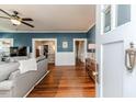 Inviting living room with hardwood floors and a seamless transition between spaces at 211 W Chisholm St, Sanford, NC 27330