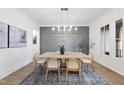 Bright dining room features stylish decor, modern lighting, and a view of the outdoors at 2809 Theresa Eileen Way, Raleigh, NC 27603